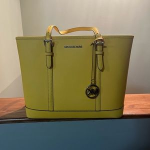 Yellow lightly used Michael Kors bag